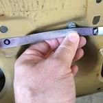 A strip of aluminum flashing cut to half inch wid