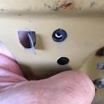 Slip the strip inside the door and slightly bend t